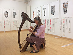 Josie Felce on harp